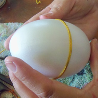 faberge egg with gold cord