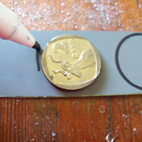 trace coin onto mosaic mirror