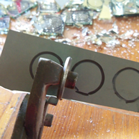 cut strip of mirror circles