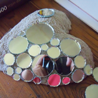 mosaic circles on papier mache heart