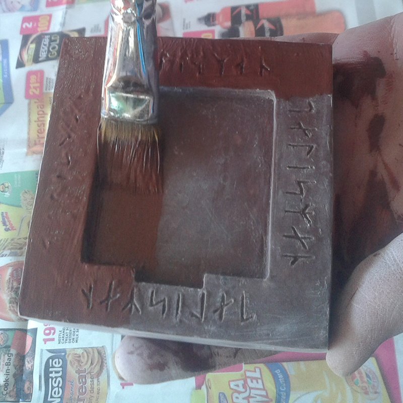 painting resin block with red umber