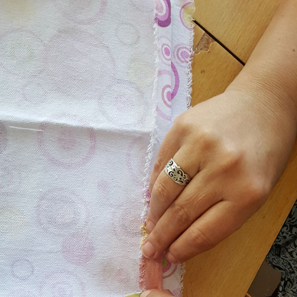 folding back top of bag 