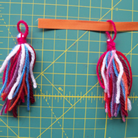 thread garland onto ribbon