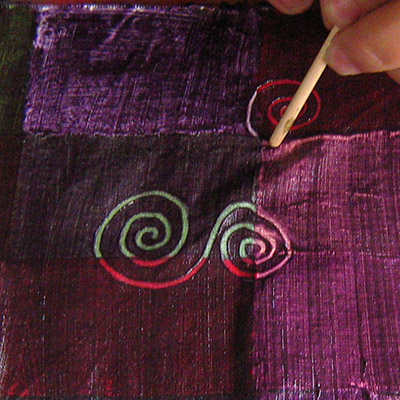 starting the pattern in the wet fabric painte