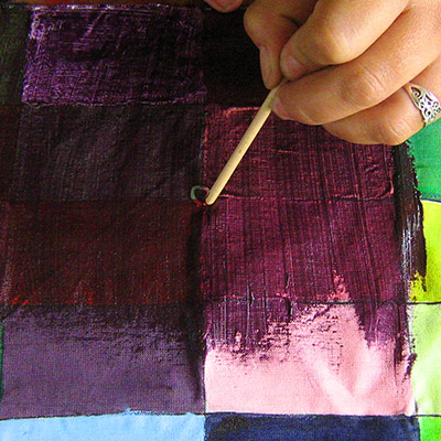 desting the scratch design in the fabric paint