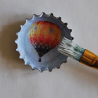 paint top of recycled bottletop with glue