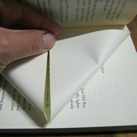 fold recycled book into triangle