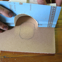 mark recycled book on masonite board