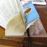 glue book onto masonite board