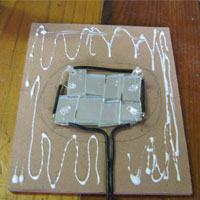 squeeze glue onto masonite board