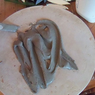 tile cement on stepping stone