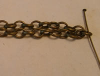 place headpin in center of chain