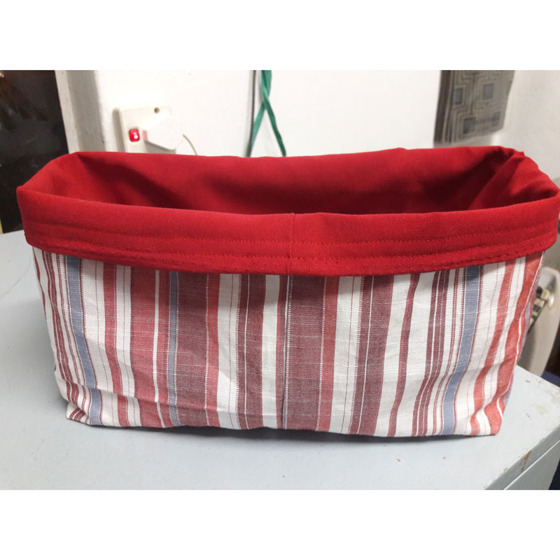 red and white square shaped fabric goody bag or utility bag