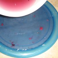 pour wax into shallow dish