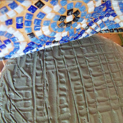 roll inverted design into cement