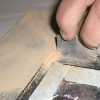 sanding the wooden frame
