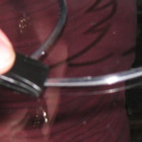 rub the decra lead firmly to stick to glass