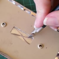 finish off pewter cover by folding edges