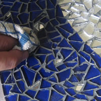 wash grout with damp sponge 