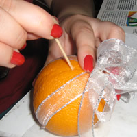 prick orange with toothpick