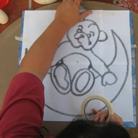 masking tape the design onto mosaic board