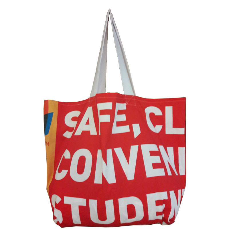 Colourful reusable shopper bag handmade from upcycled advertising banner material, with reinforced handles, made in Johannesburg, South Africa
