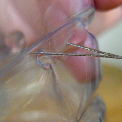 thread wire into side of botttle